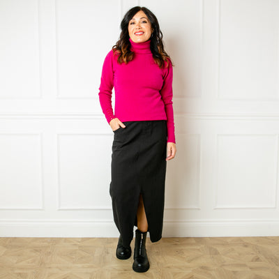 The black Raw Hem Midi Skirt made from a super stretchy fabric made of viscose, nylon and spandex